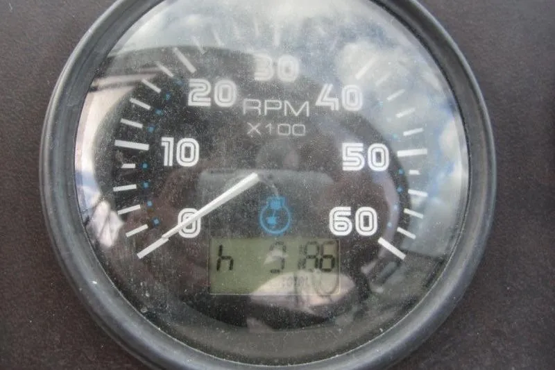 Slide: The Image of Close-up of a 2006 Carver 36 Mariner RPM gauge displaying 3198 hours. - 42