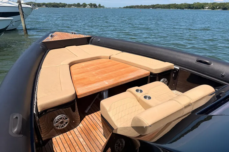Slide: The Image of Luxurious 2023 Skipper-BSK 42NC boat interior with beige seating and wooden table. - 15