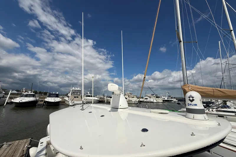 Slide: The Image of 2019 Regulator 34SS boat docked at marina under blue sky. - 19