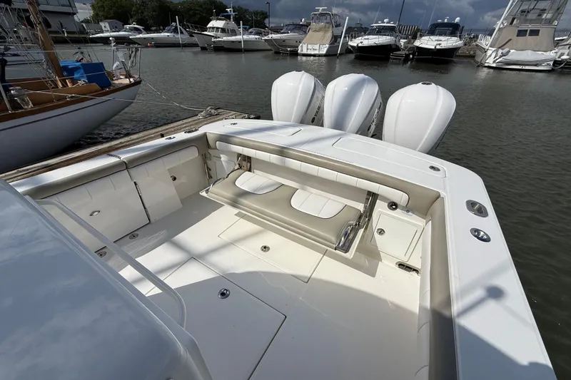 Slide: The Image of 2019 Regulator 34SS boat with triple engines docked at marina. - 9