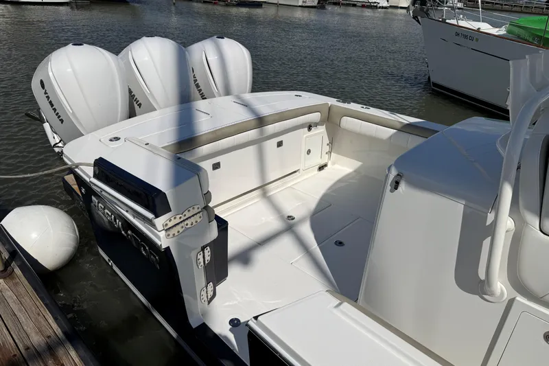 Slide: The Image of 2019 Regulator 34SS boat with Yamaha engines docked at marina. - 7