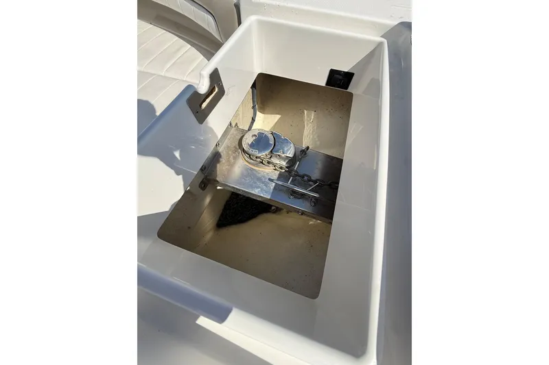 Slide: The Image of 2019 Regulator 34SS anchor locker with chain and winch mechanism. - 20