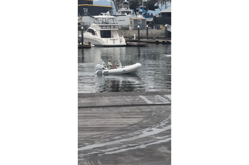 Slide: The Image of Small boat navigating marina, featuring 2027 Tide Craft San Juan 11 model. - 20