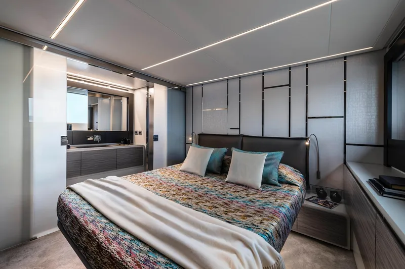 Slide: The Image of Luxurious bedroom interior of 2023 Pershing 6X yacht with modern design and elegant decor. - 12