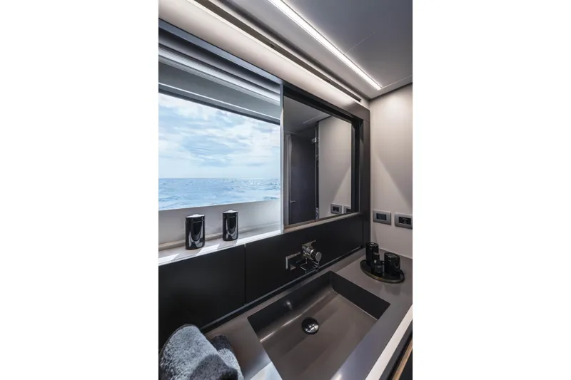Slide: The Image of Luxurious bathroom interior of 2023 Pershing 6X yacht with ocean view. - 16
