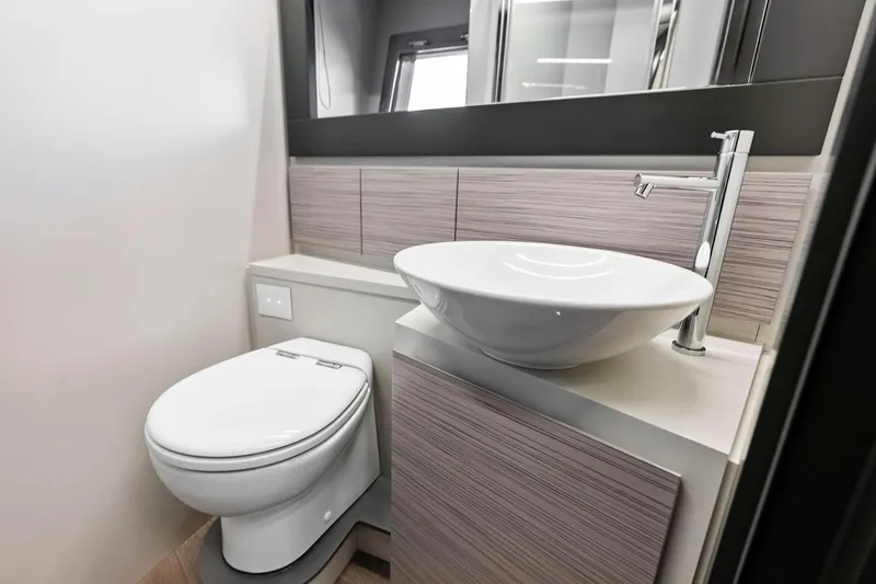 Slide: The Image of Modern bathroom in 2023 Pershing 6X yacht with sleek sink and toilet design. - 42