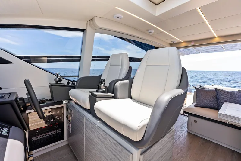 Slide: The Image of Luxurious interior of 2023 Pershing 6X yacht with modern seating and ocean view. - 24