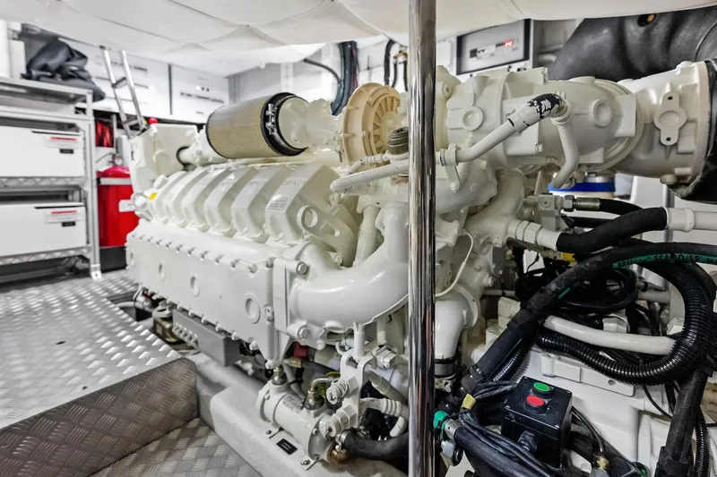 Slide: The Image of Engine room of 2023 Pershing 6X yacht, showcasing advanced machinery and components. - 57