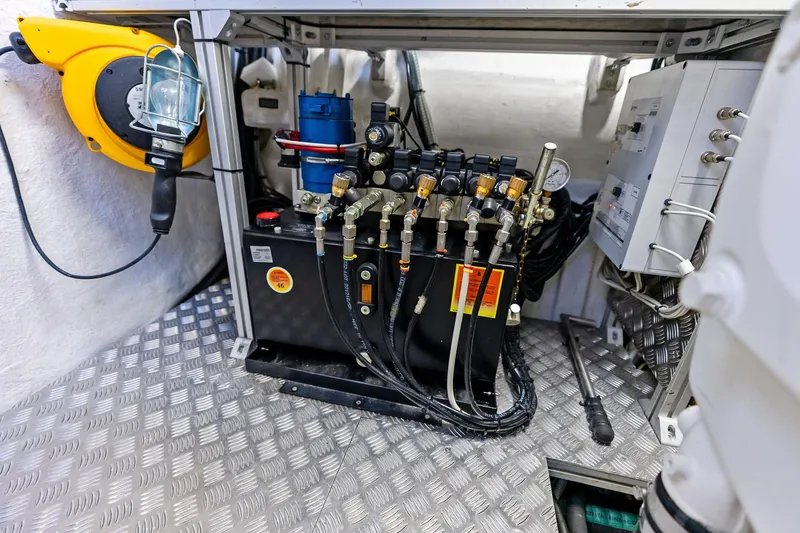 Slide: The Image of Engine room of 2023 Pershing 6X yacht, showcasing hydraulic and electrical systems. - 53