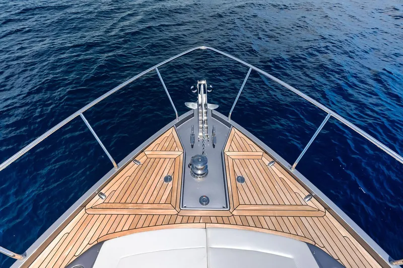 Slide: The Image of Bow of 2023 Pershing 6X yacht with teak decking on open sea. - 29