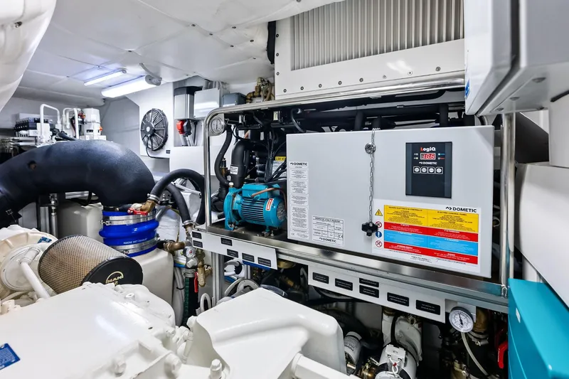 Slide: The Image of Engine room of 2023 Pershing 6X yacht, featuring advanced machinery and equipment. - 61