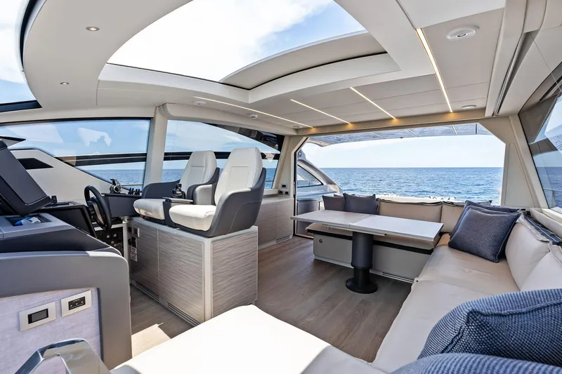 Slide: The Image of Luxurious interior of 2023 Pershing 6X yacht with ocean view and modern seating. - 28