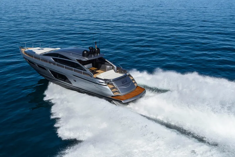 Slide: The Image of 2023 Pershing 6X yacht cruising on open sea, showcasing sleek design and powerful performance. - 7