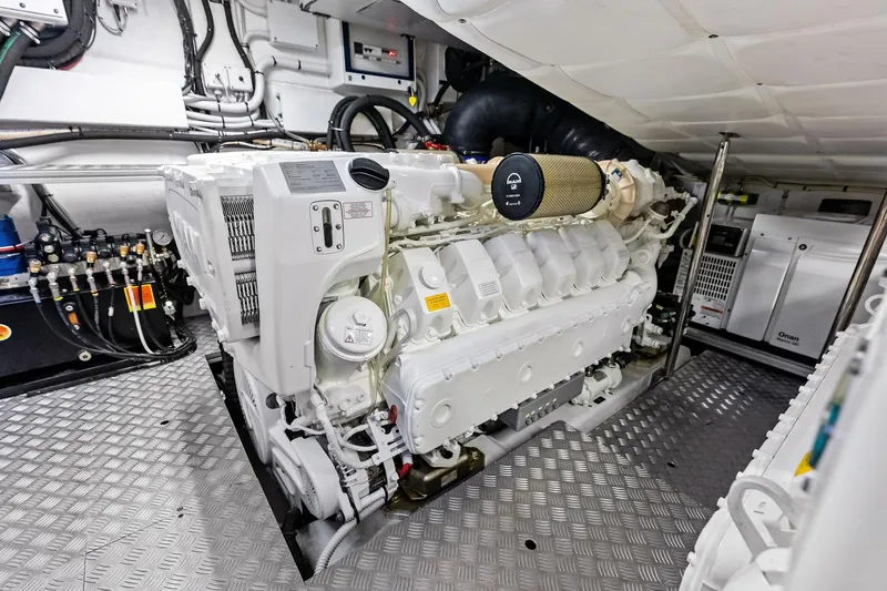 Slide: The Image of Engine room of 2023 Pershing 6X yacht, featuring advanced machinery and equipment. - 60