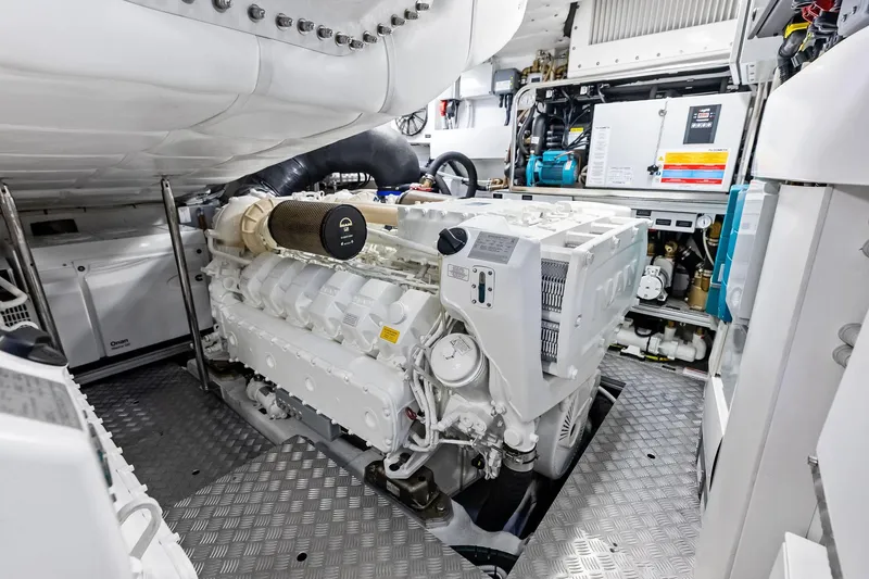 Slide: The Image of Engine room of 2023 Pershing 6X yacht showcasing advanced machinery and equipment. - 62