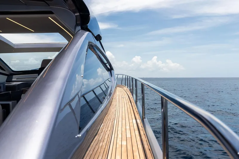 Slide: The Image of 2023 Pershing 6X yacht cruising on open sea under clear skies. - 30