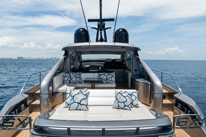 Slide: The Image of 2023 Pershing 6X yacht with luxurious seating, cruising on open sea. - 64