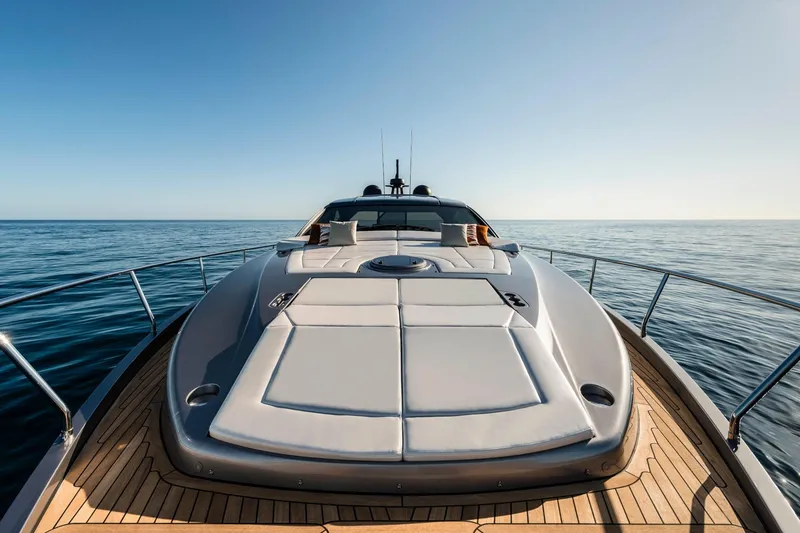 Slide: The Image of 2023 Pershing 6X yacht on open sea, showcasing sleek design and luxurious deck. - 5