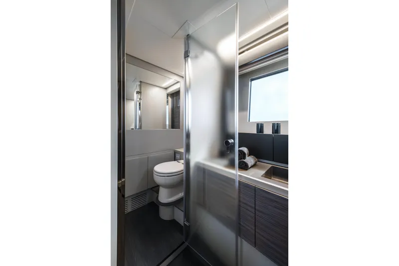Slide: The Image of Modern bathroom interior on 2023 Pershing 6X yacht, featuring sleek design and elegant fixtures. - 17
