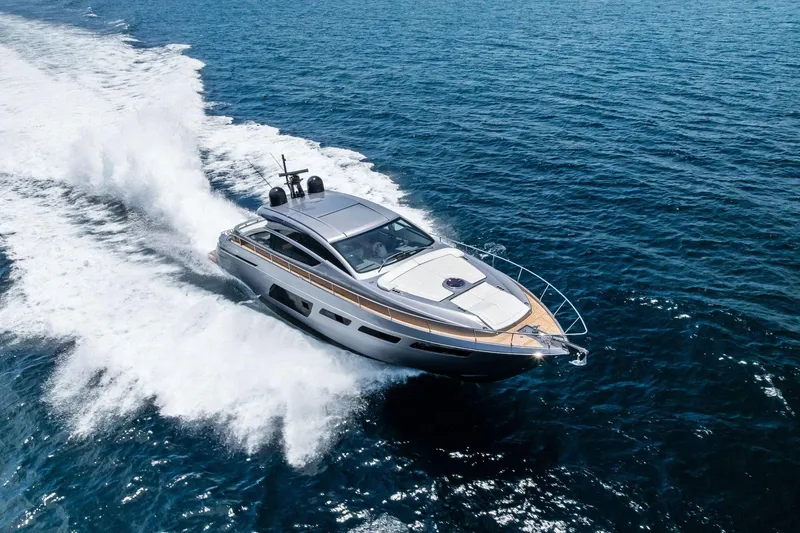 Slide: The Image of 2023 Pershing 6X yacht cruising swiftly on open blue sea. - 67