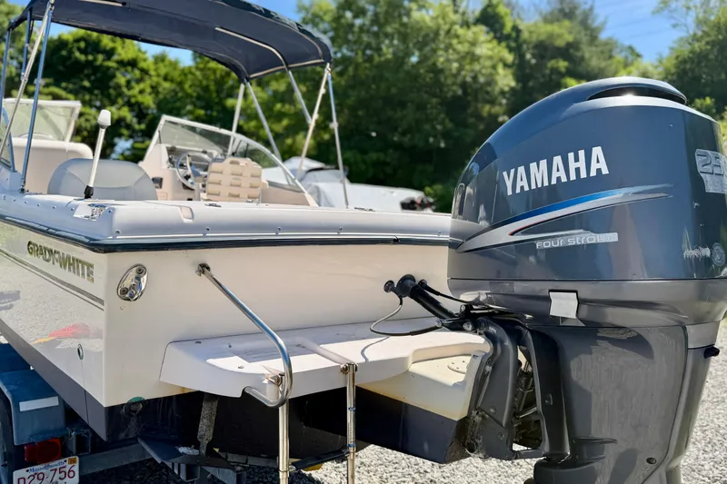 Slide: The Image of 2005 Grady-White Freedom 225 boat with Yamaha outboard motor, parked outdoors. - 14