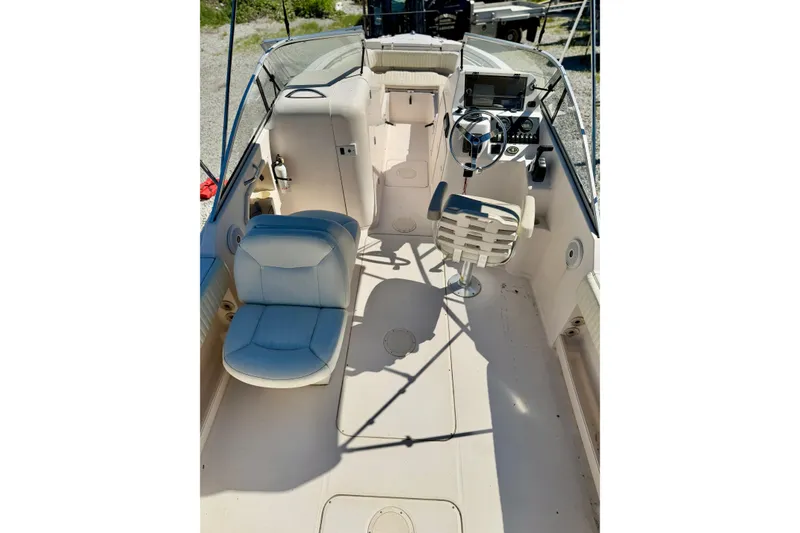 Slide: The Image of 2005 Grady-White Freedom 225 boat interior with seating and steering console. - 13