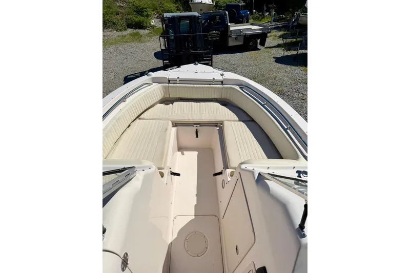 Slide: The Image of 2005 Grady-White Freedom 225 boat interior with spacious seating and storage. - 11