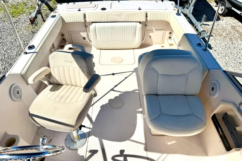 Slide: The Image of 2005 Grady-White Freedom 225 boat interior with seating and steering wheel. - 7