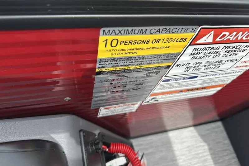 Slide: The Image of Capacity warning label on 2027 Bennington S Quad Bench 20 SSR boat. - 22