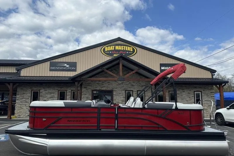 Slide: The Image of 2027 Bennington S Quad Bench 20 SSR pontoon boat outside Boat Masters dealership. - 5