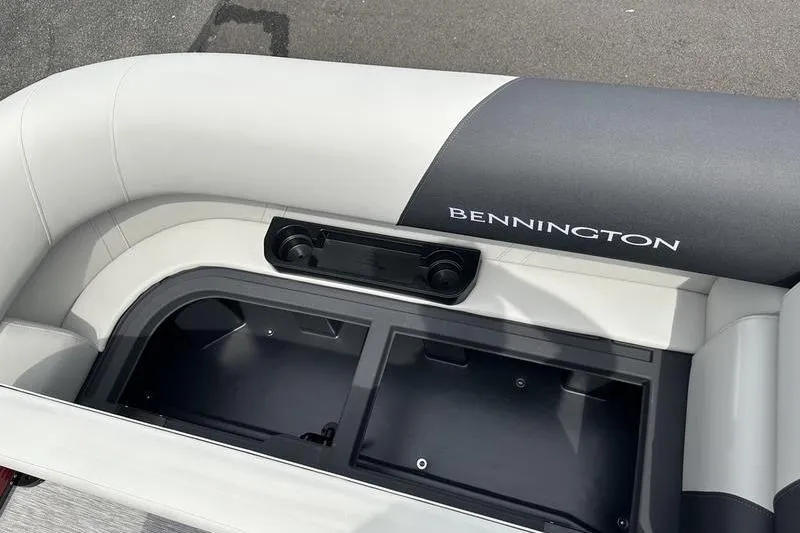 Slide: The Image of Bennington S Quad Bench 20 SSR 2027 boat seat with storage compartment open. - 20