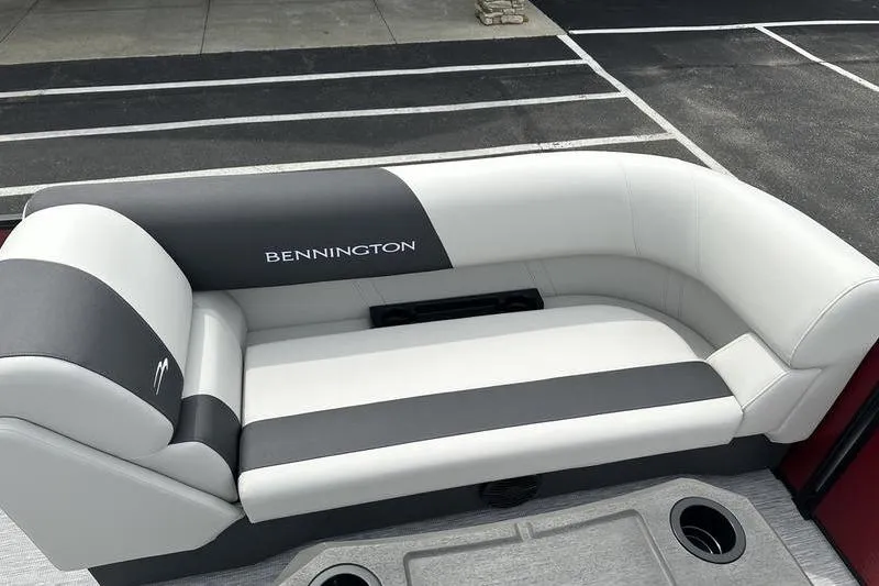 Slide: The Image of 2027 Bennington S Quad Bench 20 SSR boat seating, featuring sleek white and gray upholstery. - 10