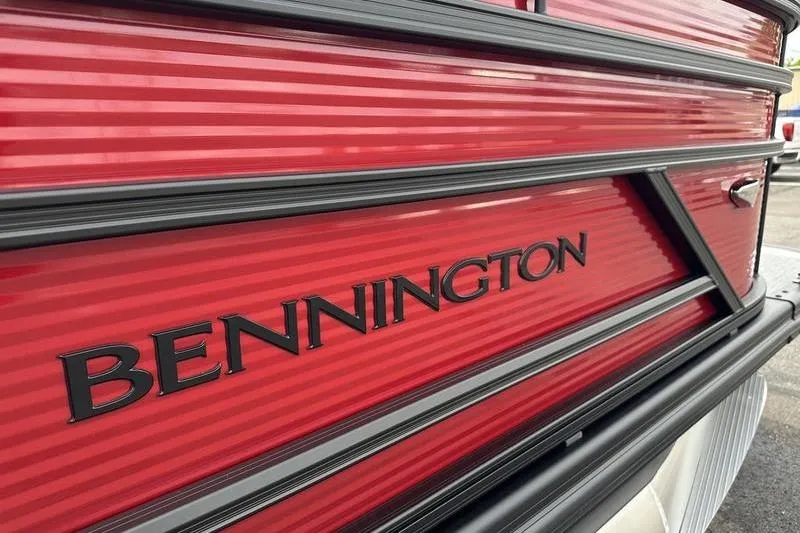Slide: The Image of Close-up of 2027 Bennington S Quad Bench 20 SSR boat with red detailing. - 33
