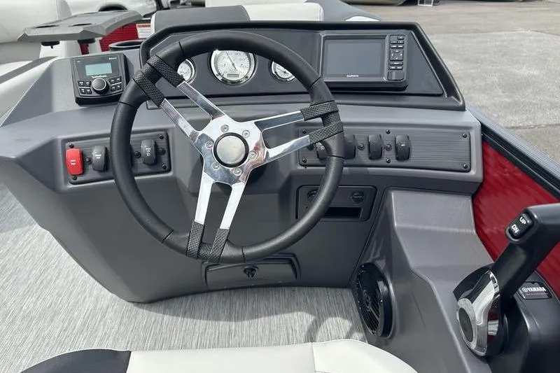 Slide: The Image of Steering console of 2027 Bennington S Quad Bench 20 SSR boat with modern controls. - 24