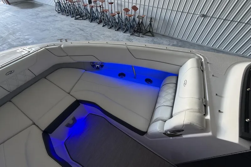 Slide: The Image of Luxurious interior of 2019 Regal LS6 boat with blue LED lighting and plush seating. - 17