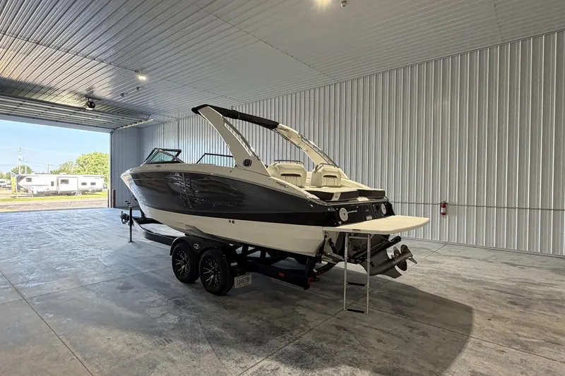 Slide: The Image of 2019 Regal LS6 boat on trailer in spacious indoor storage facility. - 3