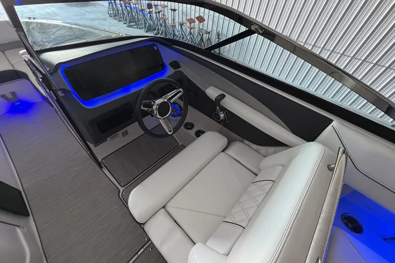 Slide: The Image of Interior of 2019 Regal LS6 boat with modern dashboard and illuminated controls. - 14