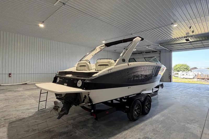Slide: The Image of 2019 Regal LS6 boat in a spacious indoor storage facility. - 5