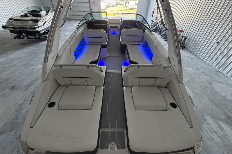 Slide: The Image of 2019 Regal LS6 boat interior with blue LED lighting in a storage facility. - 7