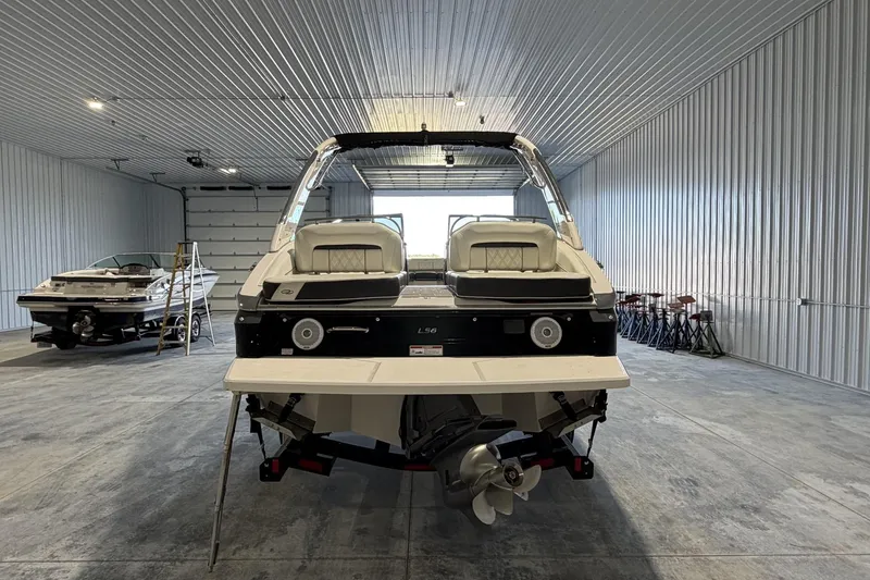 Slide: The Image of 2019 Regal LS6 boat in a spacious indoor storage facility. - 4