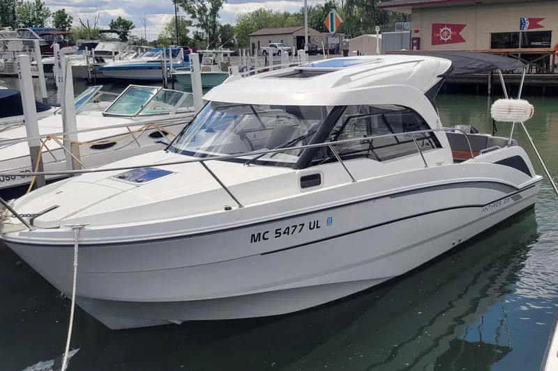 The Image of 2019 Beneteau Antares 23 boat docked at a marina, showcasing sleek design and modern features. - 0
