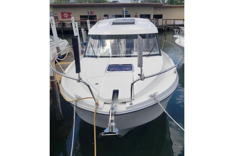Slide: The Image of 2019 Beneteau Antares 23 boat docked, showcasing sleek design and modern features. - 1