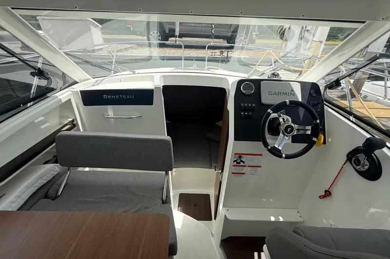 Slide: The Image of Interior view of a 2019 Beneteau Antares 23 boat with Garmin navigation system. - 13