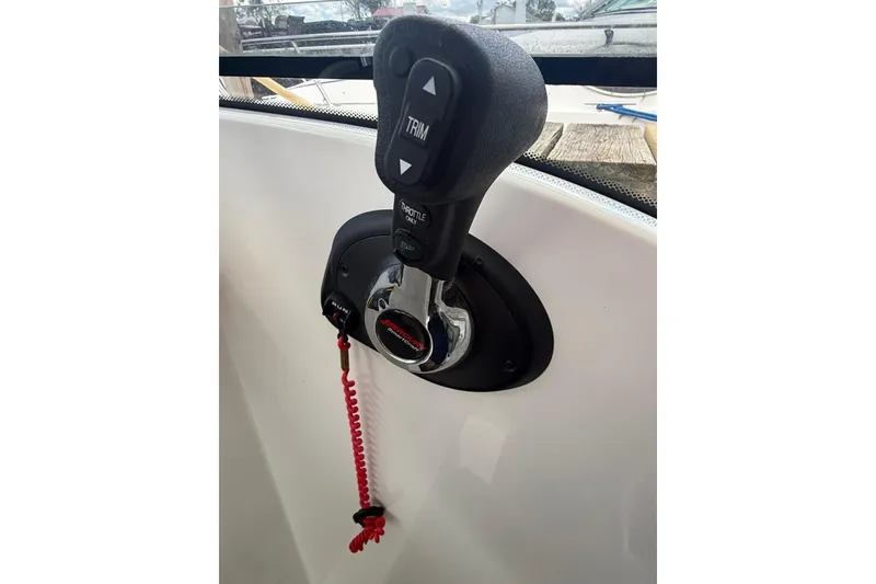Slide: The Image of Throttle control of 2019 Beneteau Antares 23 boat with safety lanyard. - 16