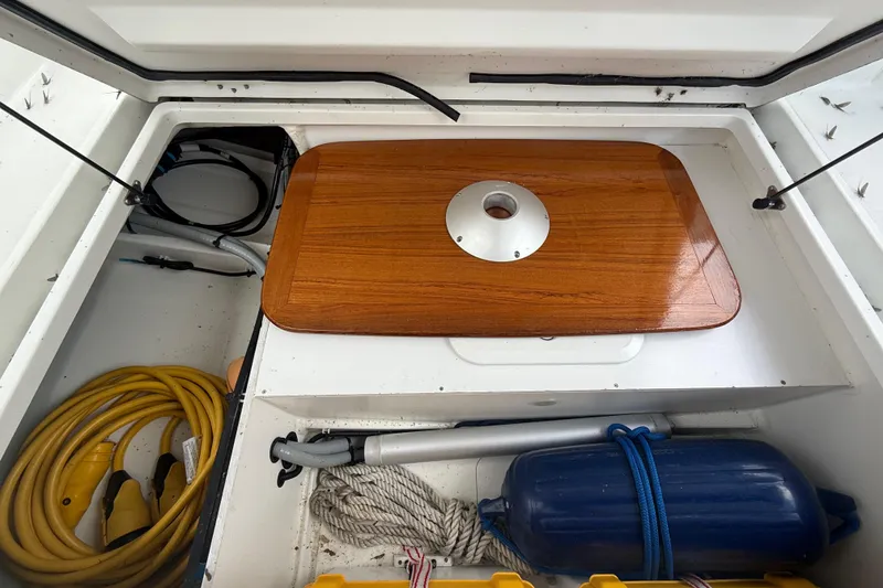 Slide: The Image of Storage compartment of a 2019 Beneteau Antares 23 boat with equipment and accessories. - 6