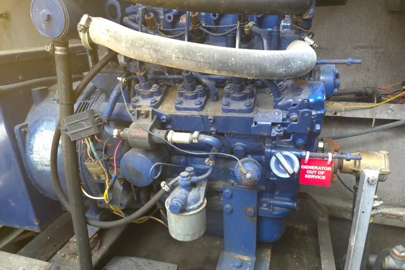 Slide: The Image of Engine of a 1974 Breaux's Bay Craft Passenger vessel, marked "Generator Out of Service." - 14