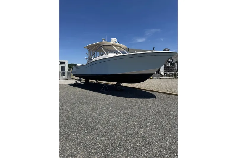 The Image of 2020 Grady-White Freedom 325 boat on display under clear blue sky. - 0