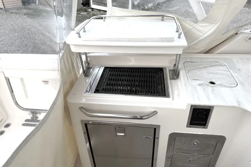 Slide: The Image of Outdoor grill and sink on a 2020 Grady-White Freedom 325 boat. - 15