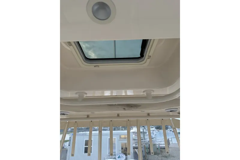 Slide: The Image of 2020 Grady-White Freedom 325 boat interior with skylight view. - 18