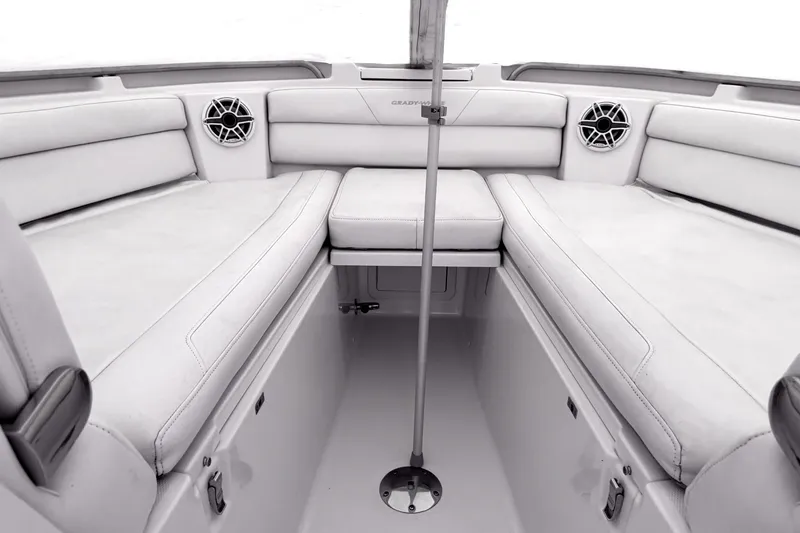 Slide: The Image of Interior of 2020 Grady-White Freedom 325 boat with white seating and speakers. - 4